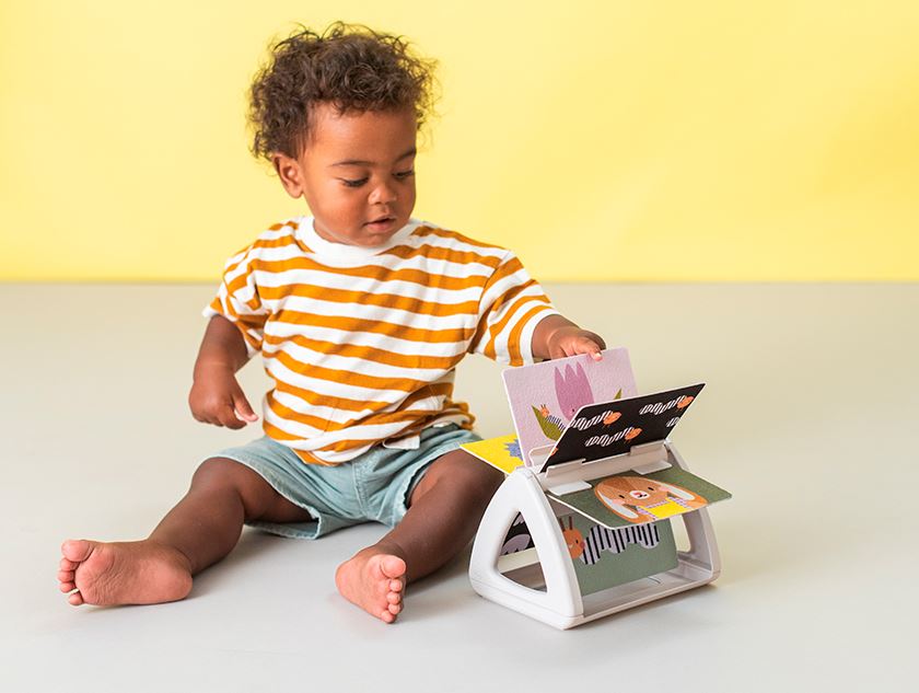 TAF TOYS - LIVRE TOURNANT POSITION VENTRALE